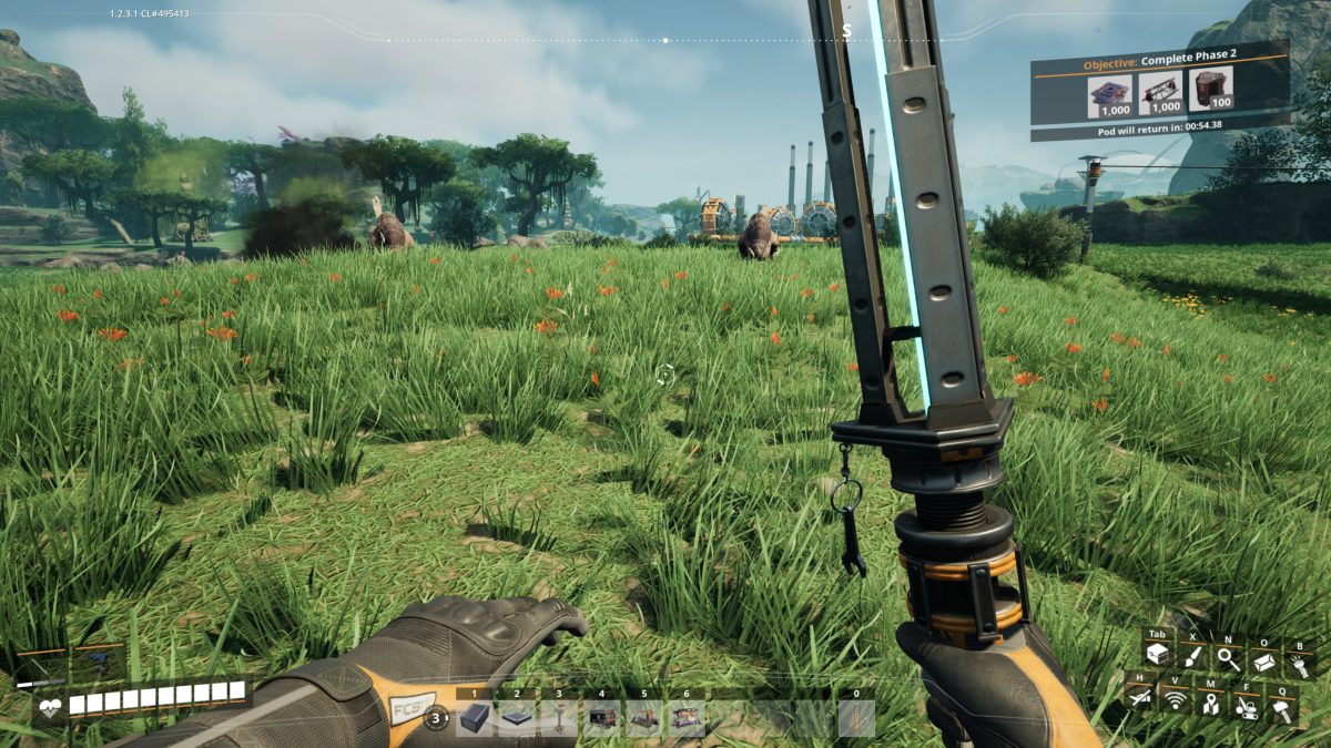 The Xeno-Basher melee weapon held in first person in a grassy field in Satisfactory, with the coal plant in the distance