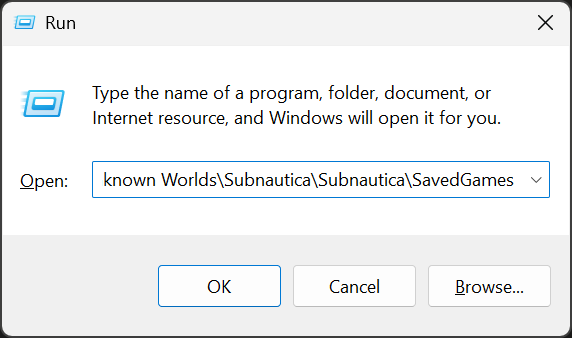 The Windows Run dialog with the Epic Subnautica SavedGames path pasted into the Open field