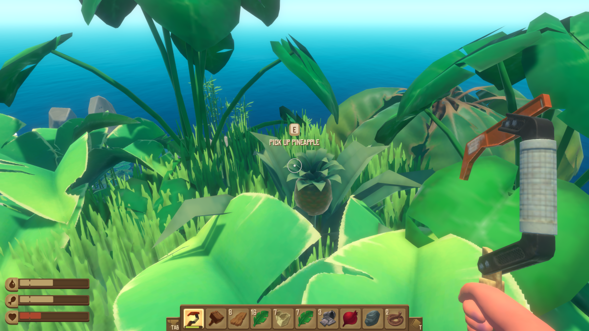 A pineapple growing among island foliage with a Press E to pick up pineapple prompt in Raft