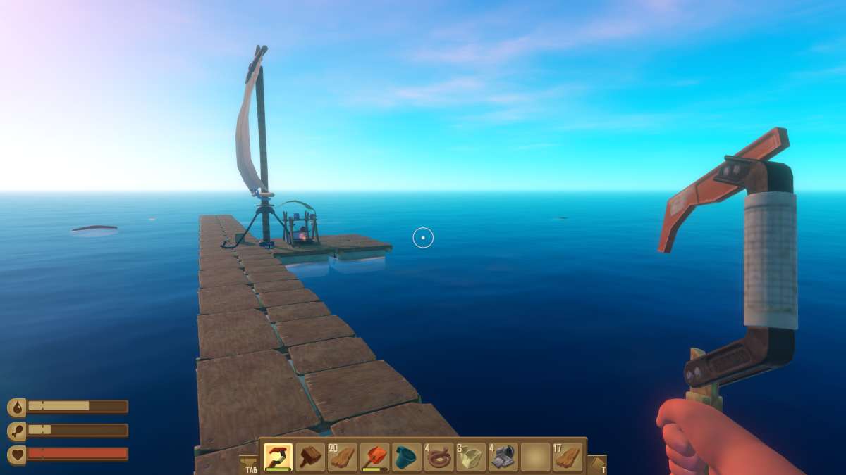A view down the raft with the sail raised and a grill and purifier station set up in Raft