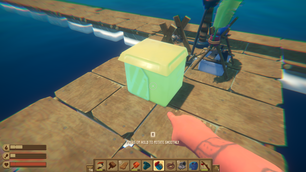 Placing a Small Storage container on the raft deck in Raft