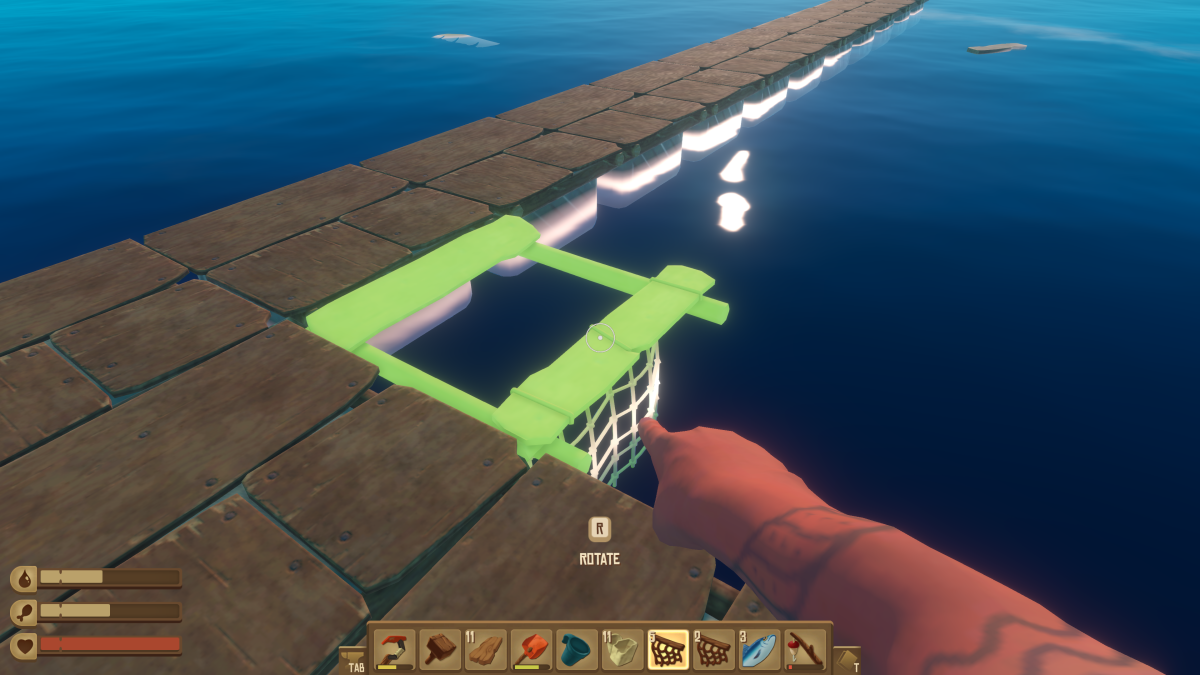 Placing a Simple Collection Net along the raft edge in Raft, green placement preview